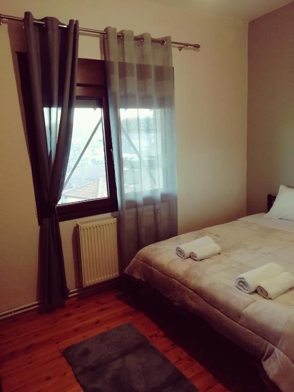 Posteľ alebo postele v izbe v ubytovaní Ξενωνας Κάρμα