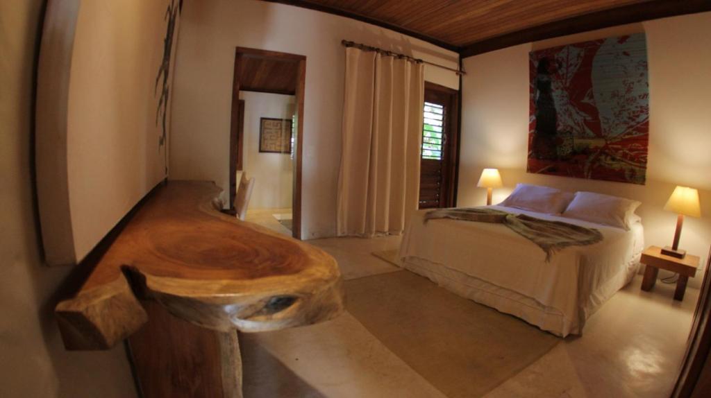 Postel nebo postele na pokoji v ubytování Camauí Hotel