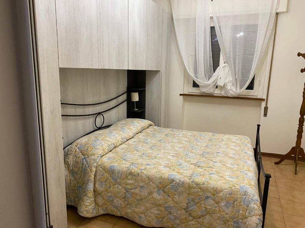 A bed or beds in a room at Casa versilia