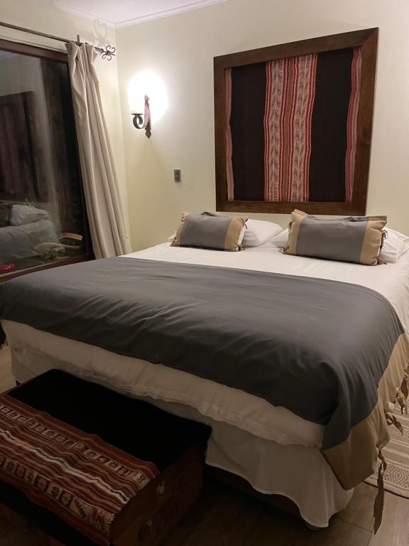Postel nebo postele na pokoji v ubytování Nenquen Lodge