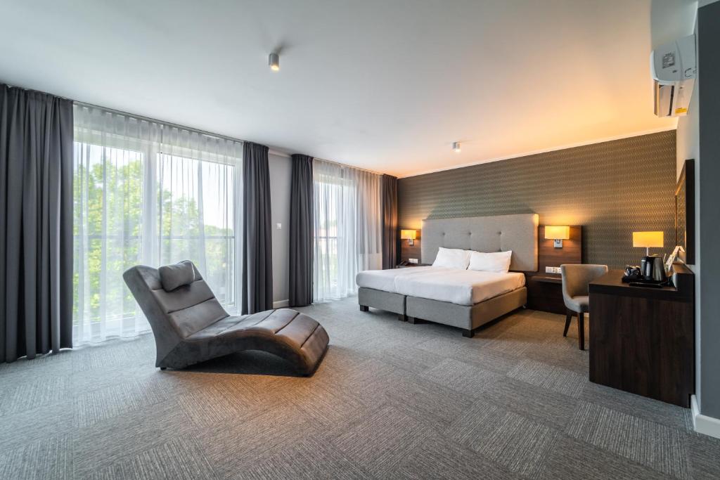 Ένα ή περισσότερα κρεβάτια σε δωμάτιο στο Hotel Weneda