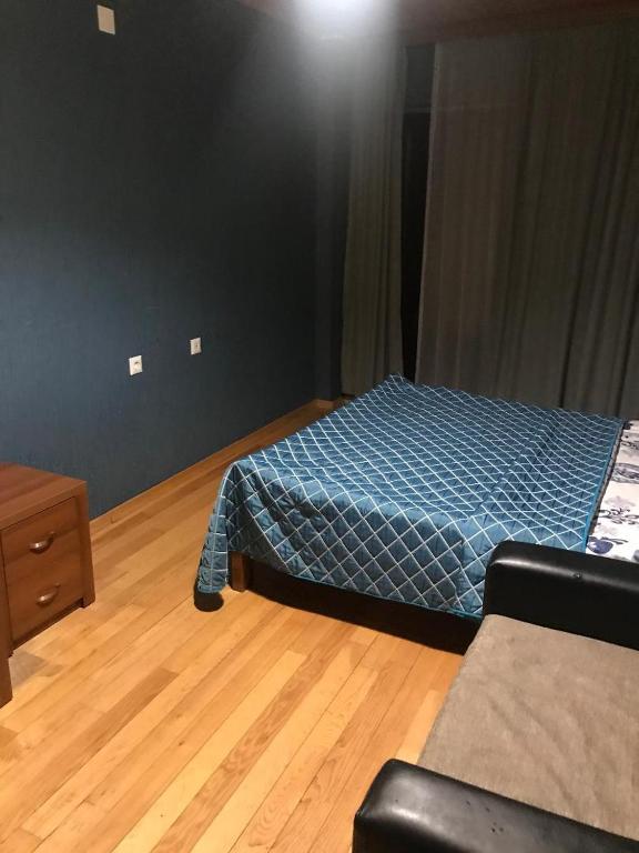Postel nebo postele na pokoji v ubytování Guesthouse David Zhorzholiani