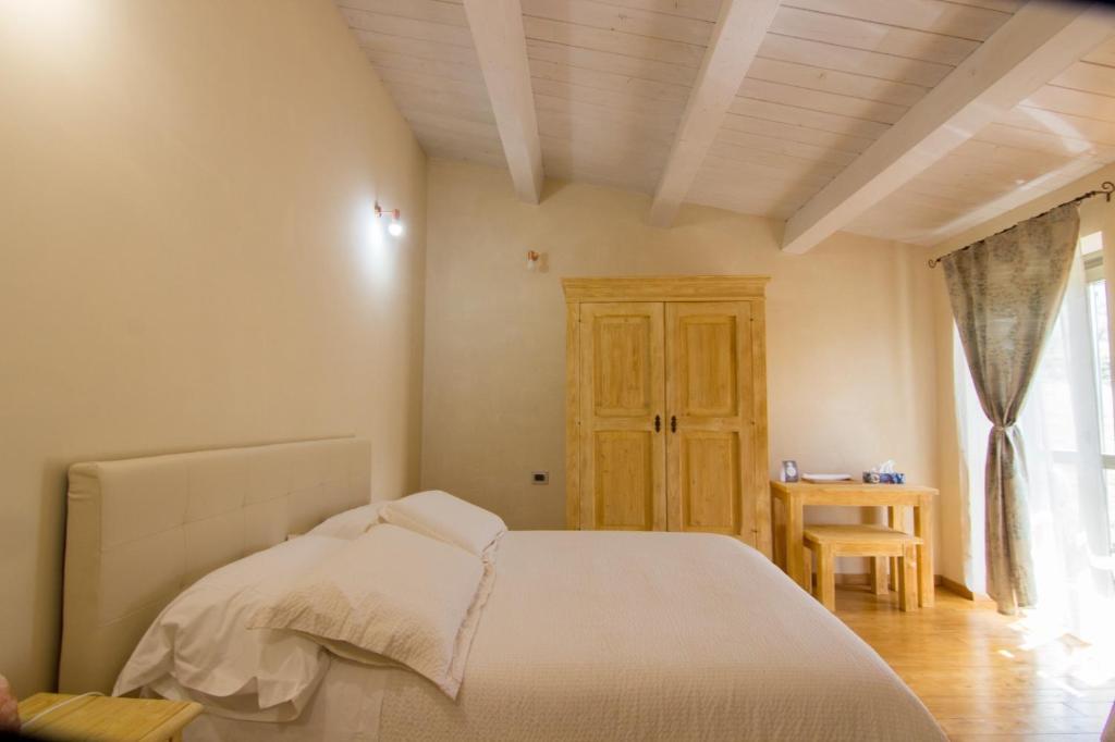 Ένα ή περισσότερα κρεβάτια σε δωμάτιο στο Tenuta del Savonisco