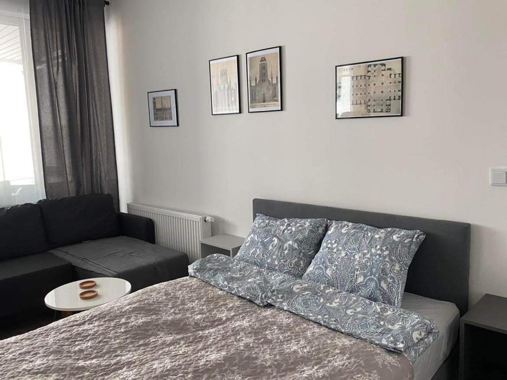 Posteľ alebo postele v izbe v ubytovaní Apartament Granary