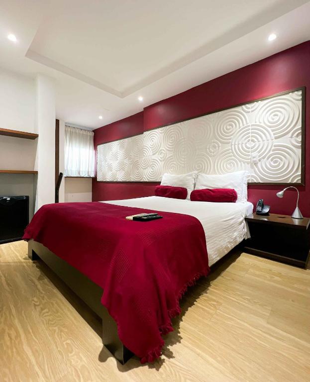 Postel nebo postele na pokoji v ubytování Hotel Florencia Plaza