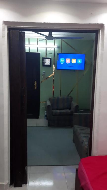 a view of a room with a couch and a television at وسط البلد عابدين in Cairo