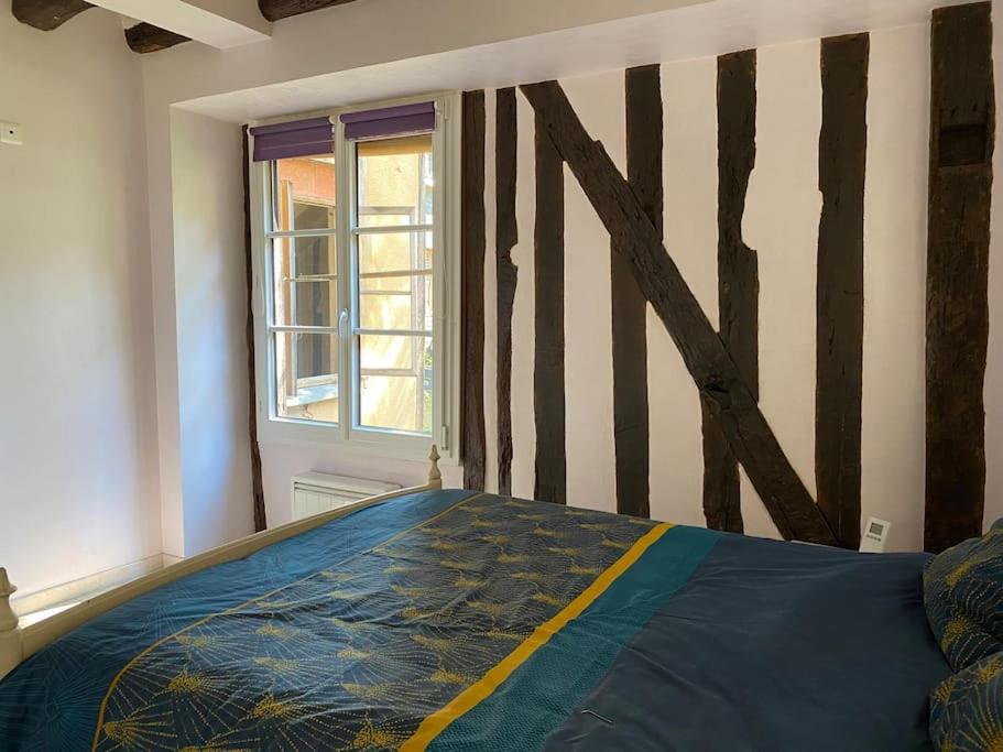 Posteľ alebo postele v izbe v ubytovaní Charmant appartement - centre Cité Plantagenet!!!