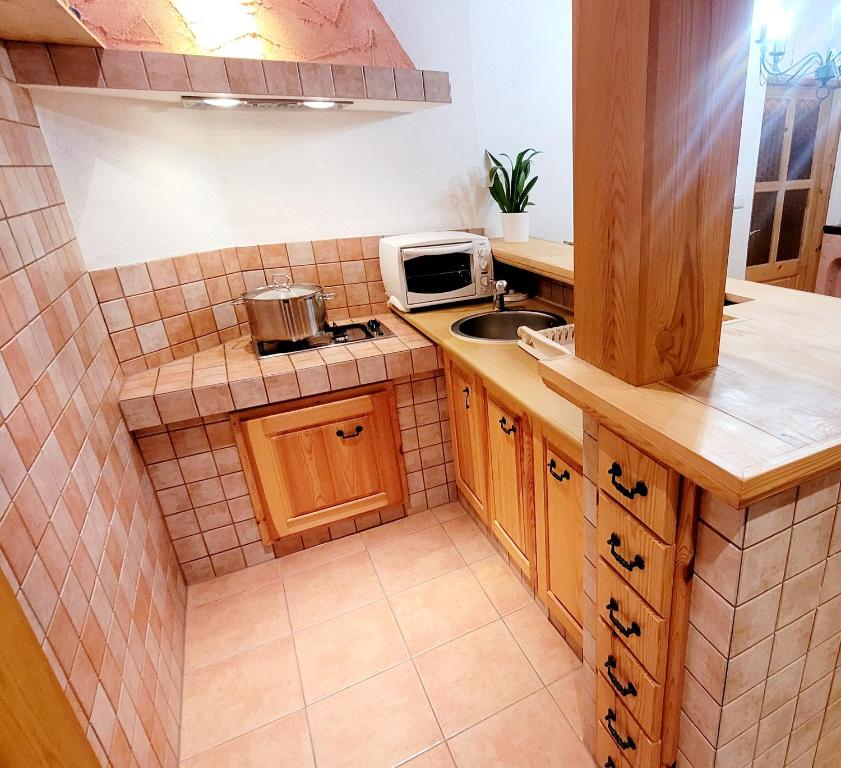Kuchyň nebo kuchyňský kout v ubytování Apartmány Anička vo Važci