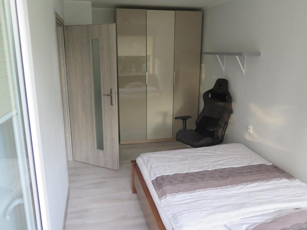 Posteľ alebo postele v izbe v ubytovaní Apartament Nadmorski Piastowska 66