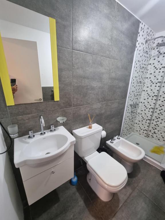 a bathroom with a sink and a toilet and a shower at BEM Apartamento in Salta