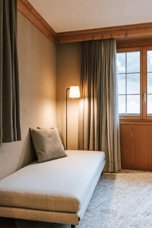Postel nebo postele na pokoji v ubytování Hotel Fiescherblick