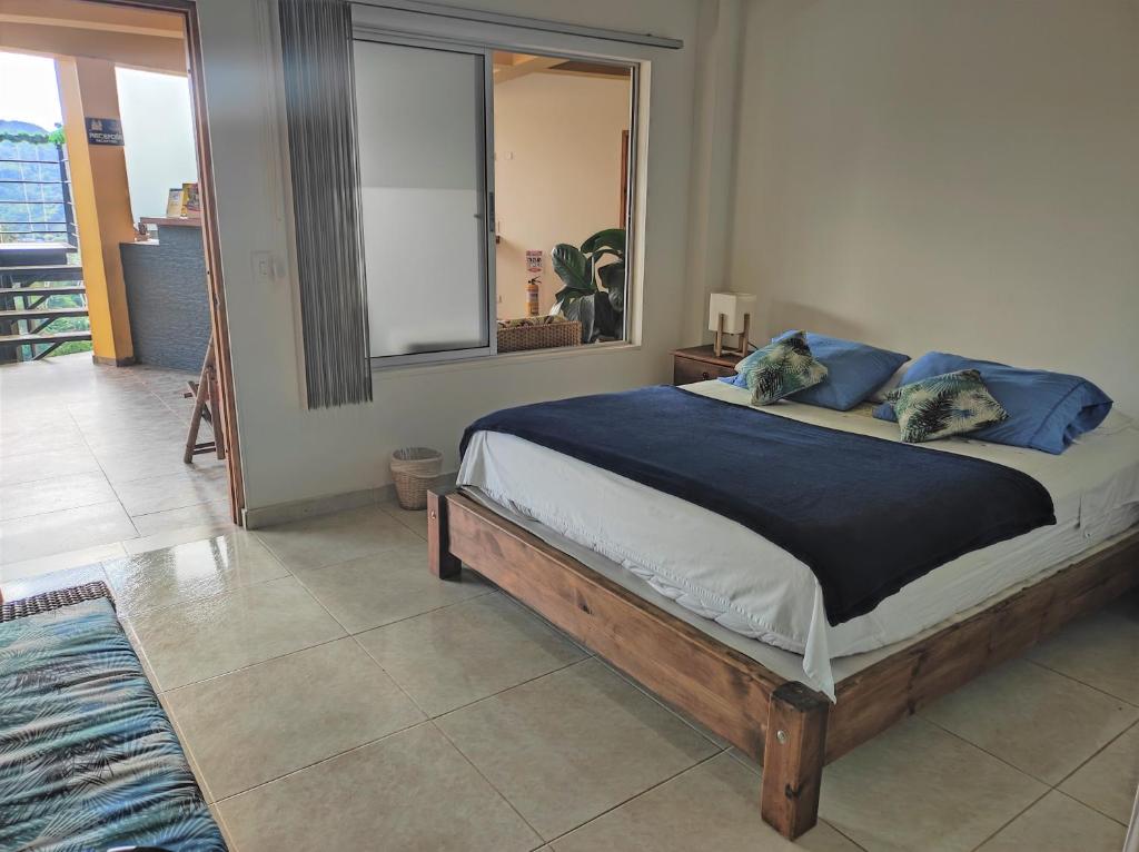 Postel nebo postele na pokoji v ubytování Tambo Eco Hotel