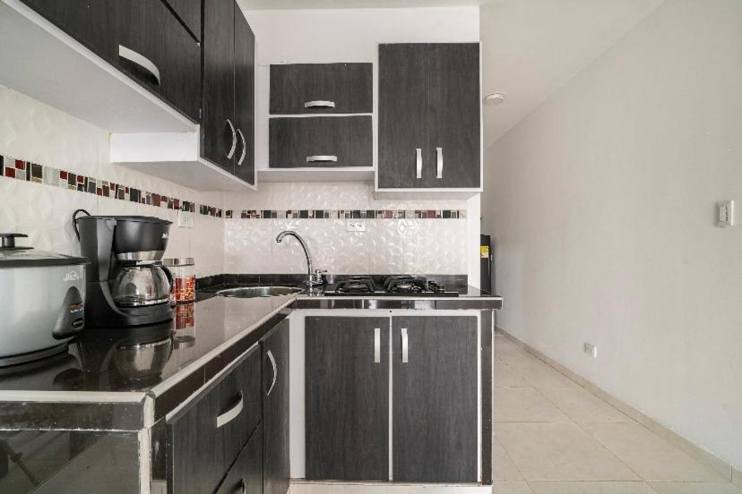 A kitchen or kitchenette at Apartamento con Estacionamiento