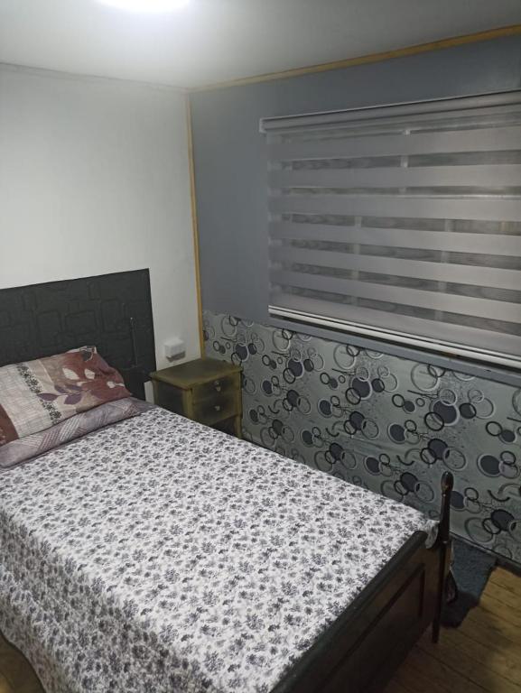 Una cama o camas en una habitación de Hostel INK - Duerme Como En Casa