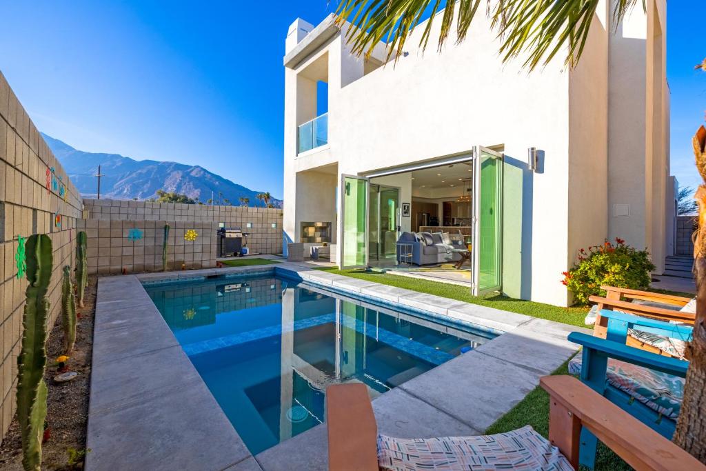 a swimming pool in the backyard of a house at Breathtaking Luxury Villa Architectural Jewel in Palm Springs