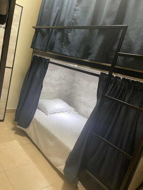 Letto o letti in una camera di HOSTAL XAO