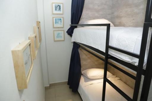 Letto o letti in una camera di HOSTAL XAO