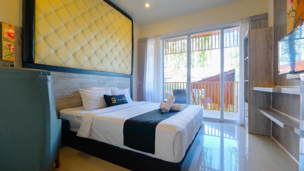 Postel nebo postele na pokoji v ubytování Graha Socio Hotel Nusa Dua Bali
