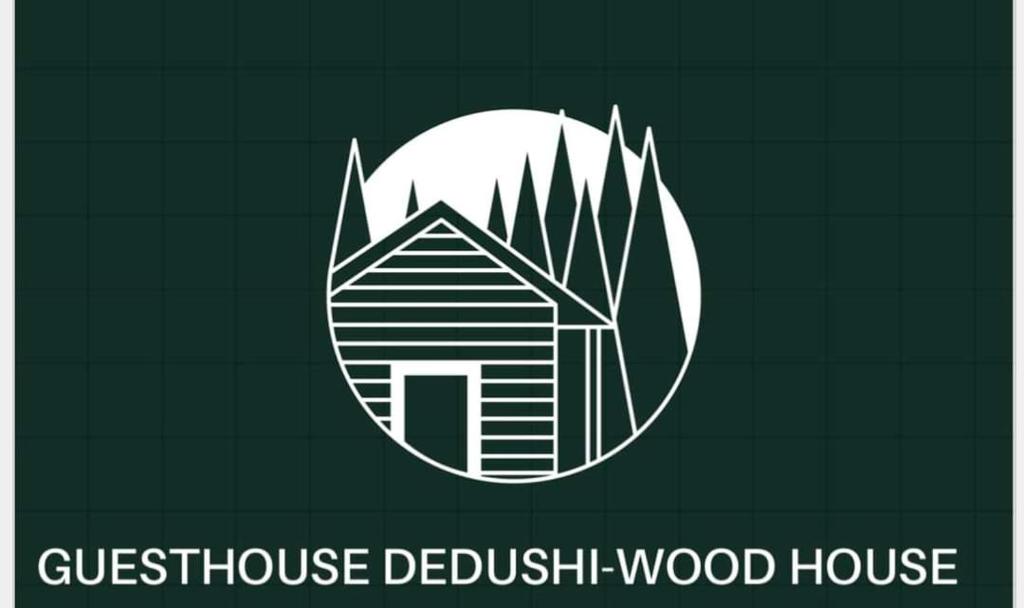 a logo for a wood house in front of the moon at Dedushi Guesthouse &Wood cabins-Camping place in Gusinje