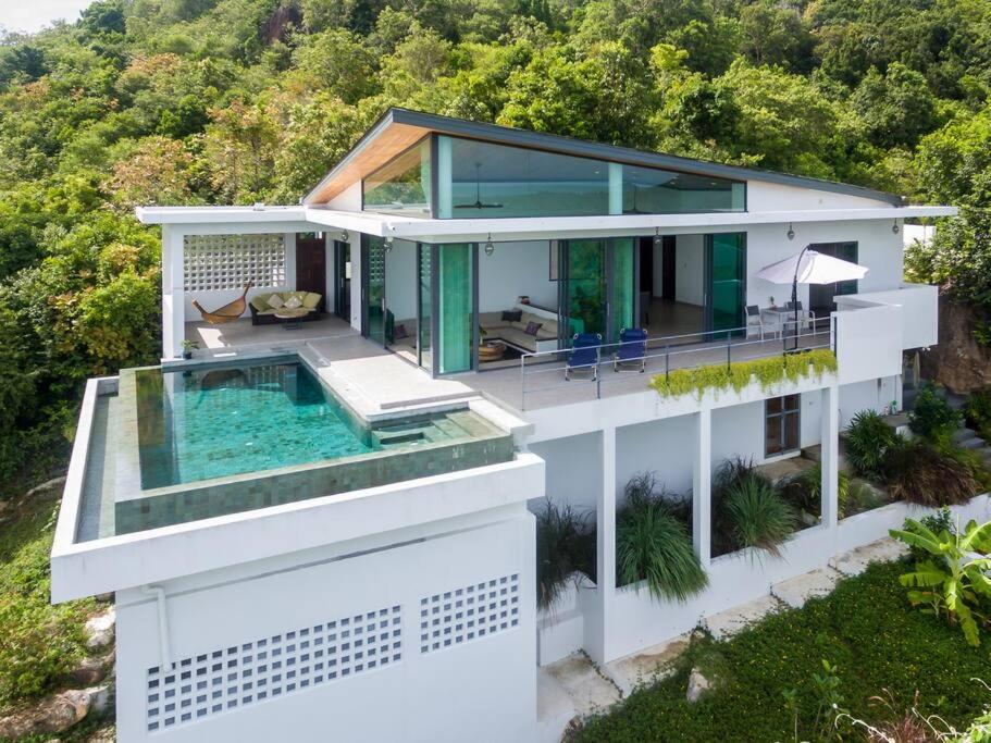 an aerial view of a house with a swimming pool at Stunning SeaView Pool Villa in Haad Pleayleam