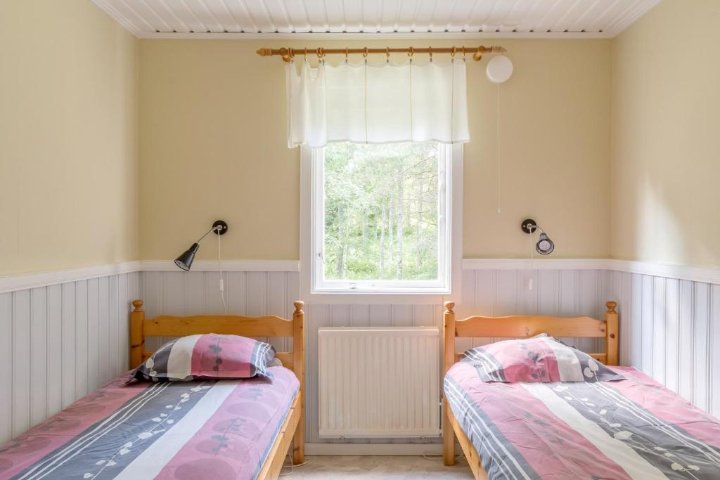 Postel nebo postele na pokoji v ubytování First Camp Hökensås-Tidaholm