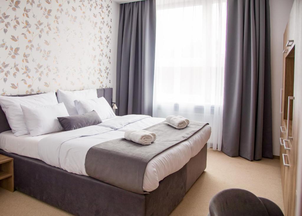 Postel nebo postele na pokoji v ubytování Family Resort Lučivná