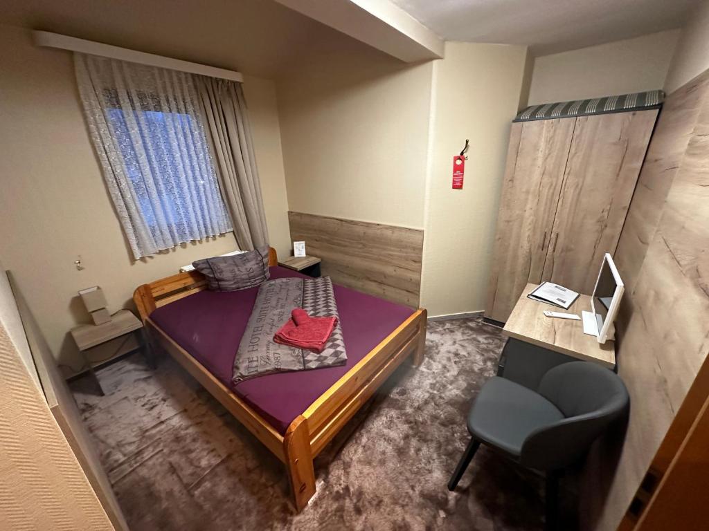 Postel nebo postele na pokoji v ubytování Hotel Pension Pamina