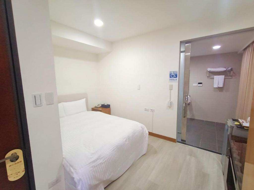Postel nebo postele na pokoji v ubytování Tianmu Star Urban Living