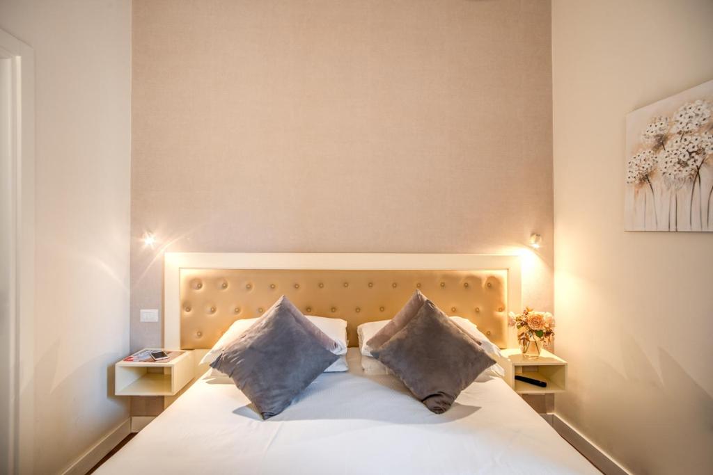 Postel nebo postele na pokoji v ubytování Hotel San Silvestro