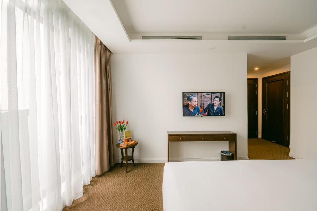 Postel nebo postele na pokoji v ubytování Marigold Hotel Hanoi