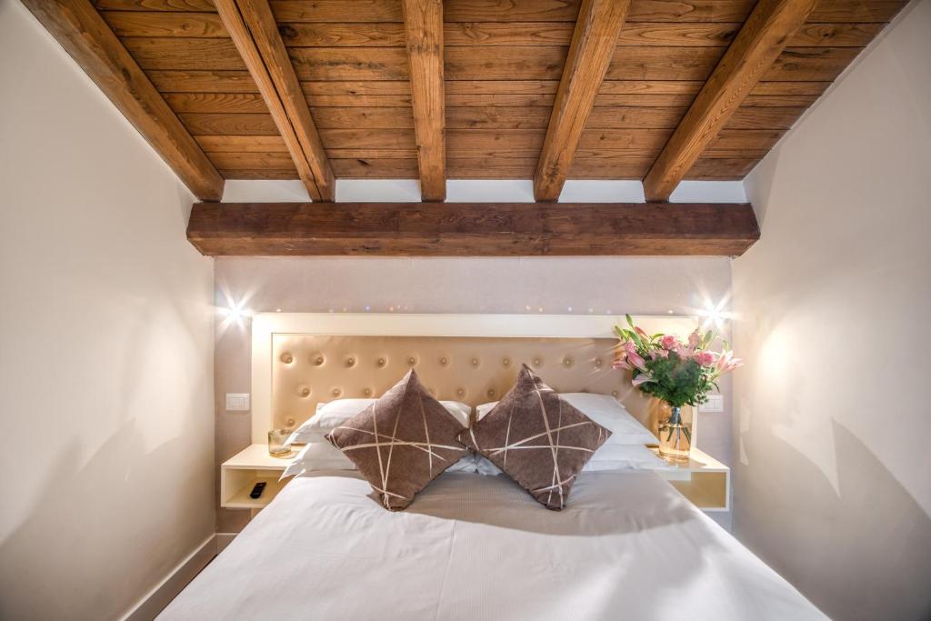 Postel nebo postele na pokoji v ubytování Hotel San Silvestro