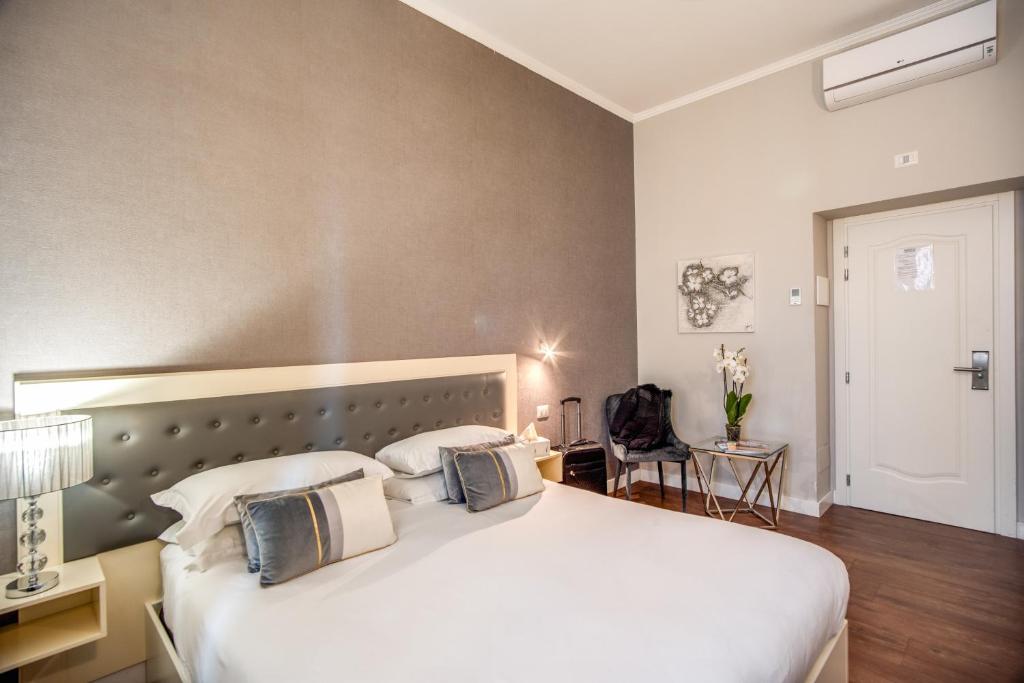 Postel nebo postele na pokoji v ubytování Hotel San Silvestro