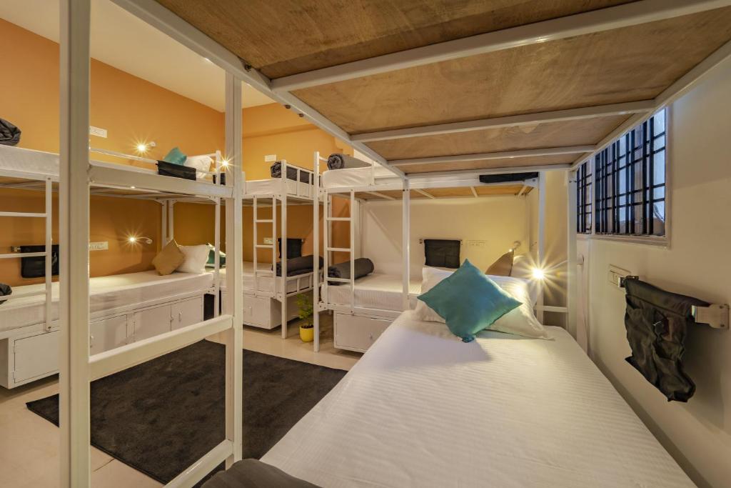 a bedroom with bunk beds in a room at Zostel Hyderabad in Hyderabad