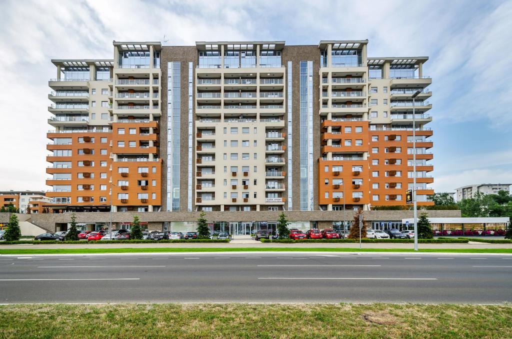 a large apartment building with a street in front of it at A BLOK1 NEW BELGRADE in Novi Beograd