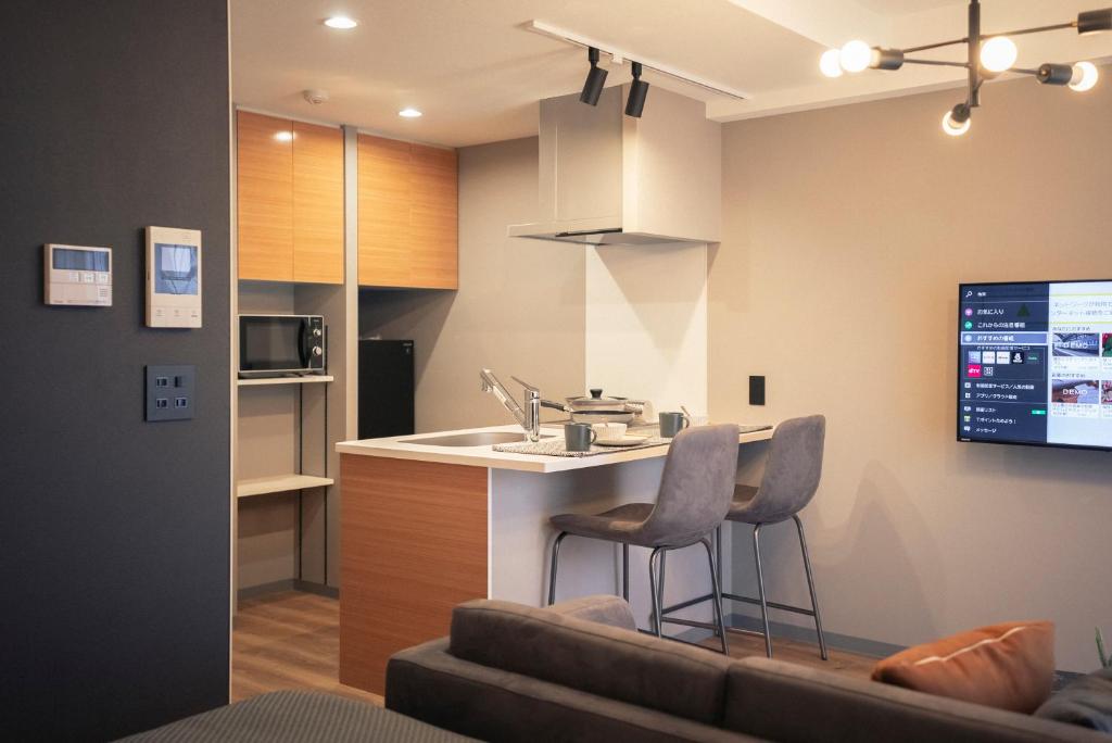 Kuchyň nebo kuchyňský kout v ubytování 谷町君HOTEL 心斎橋東32