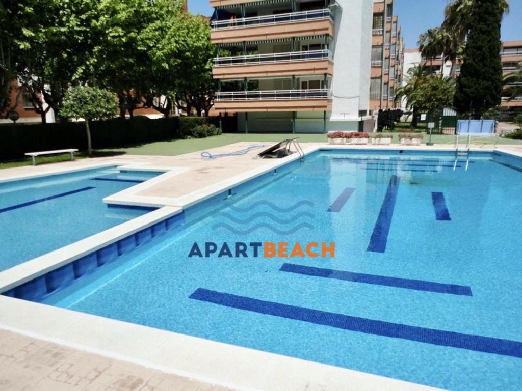 a swimming pool in front of a building at APARTBEACH SALOU y PLAYA 742 in Salou