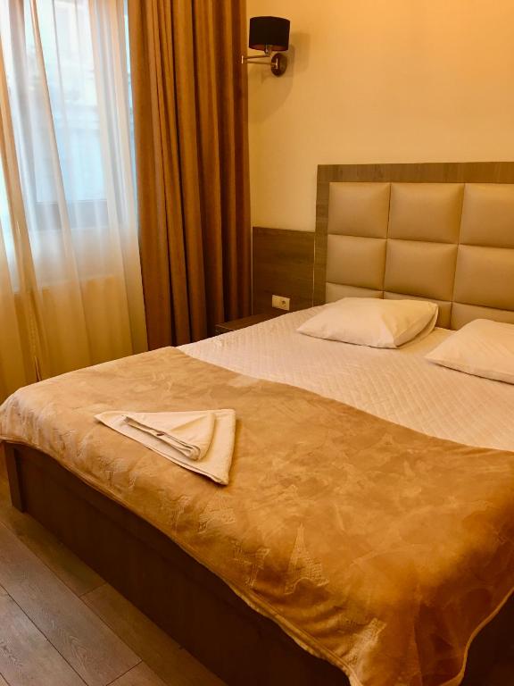 Postel nebo postele na pokoji v ubytování Iveria