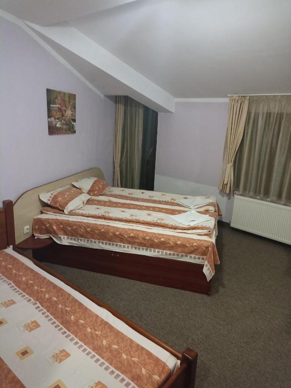 Postel nebo postele na pokoji v ubytování Petar Guest House