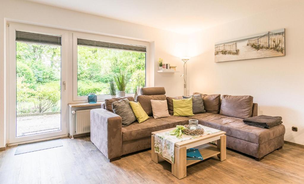 a living room with a couch and a table at "Ferienwohnug Bambergers" Ferienwohnung Bamberger s in Büsumer Deichhausen