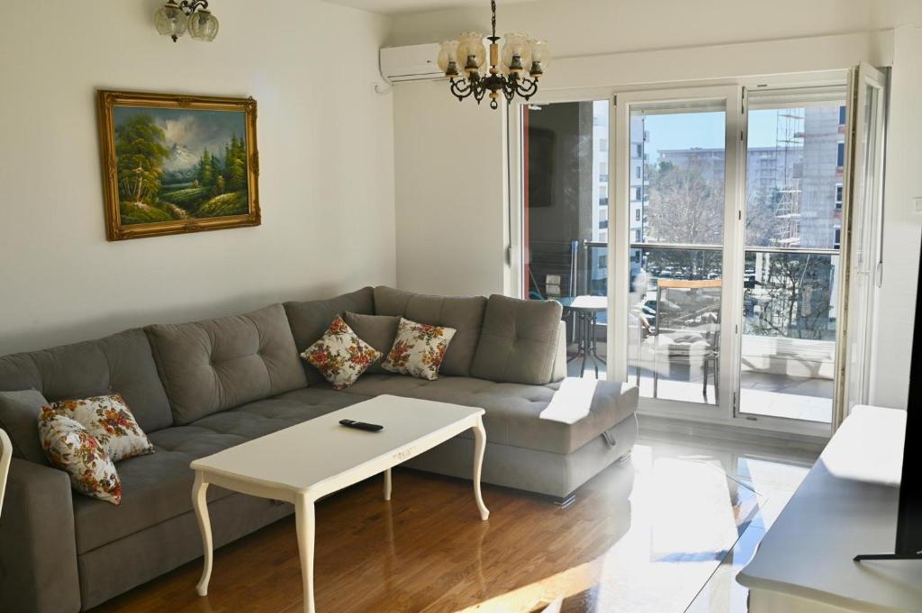 a living room with a couch and a table at Apartment Lola in Trebinje