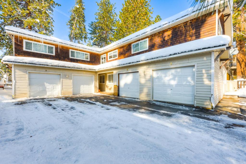 a house with two garage doors in the snow at Incline Village Getaway in Incline Village