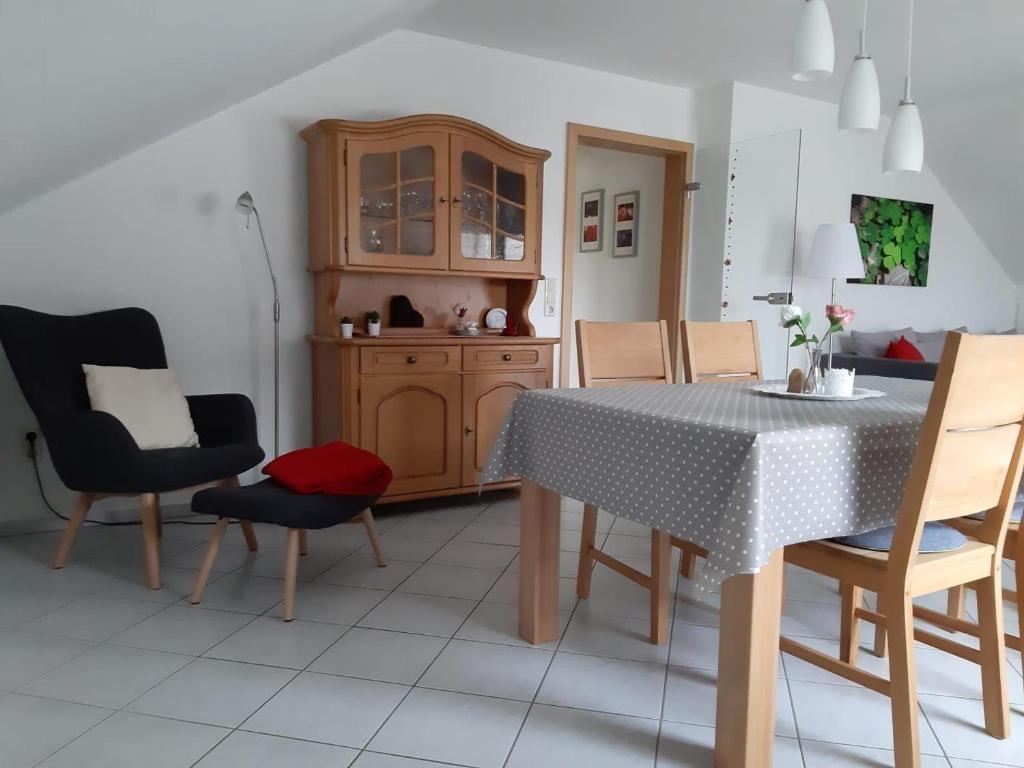 a kitchen with a dining room table and chairs at Ferienwohnung-Christa-Salem in Salem