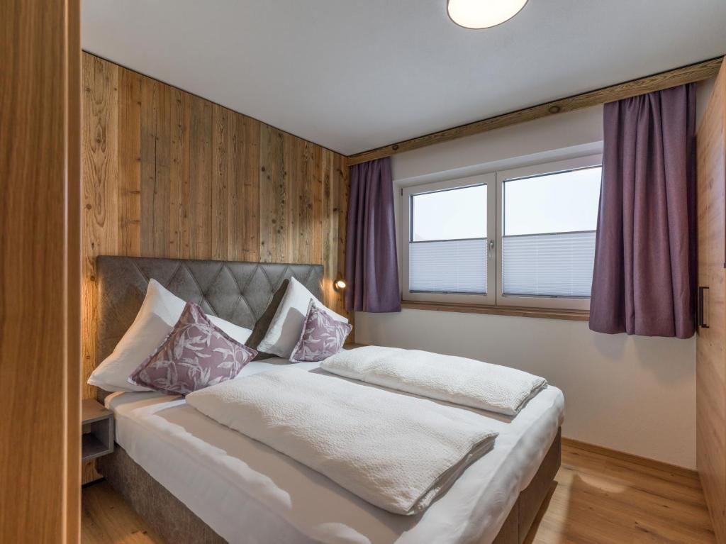 Postel nebo postele na pokoji v ubytování Alps Holaus