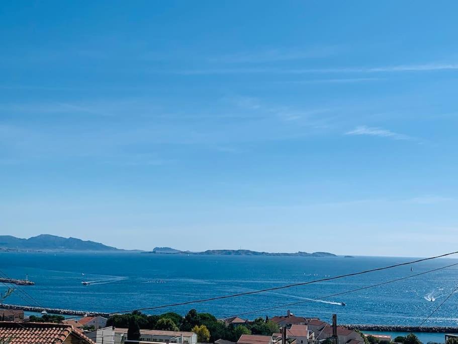 a view of a body of water from a city at Magnifique vue sur la mer ... in Marseille