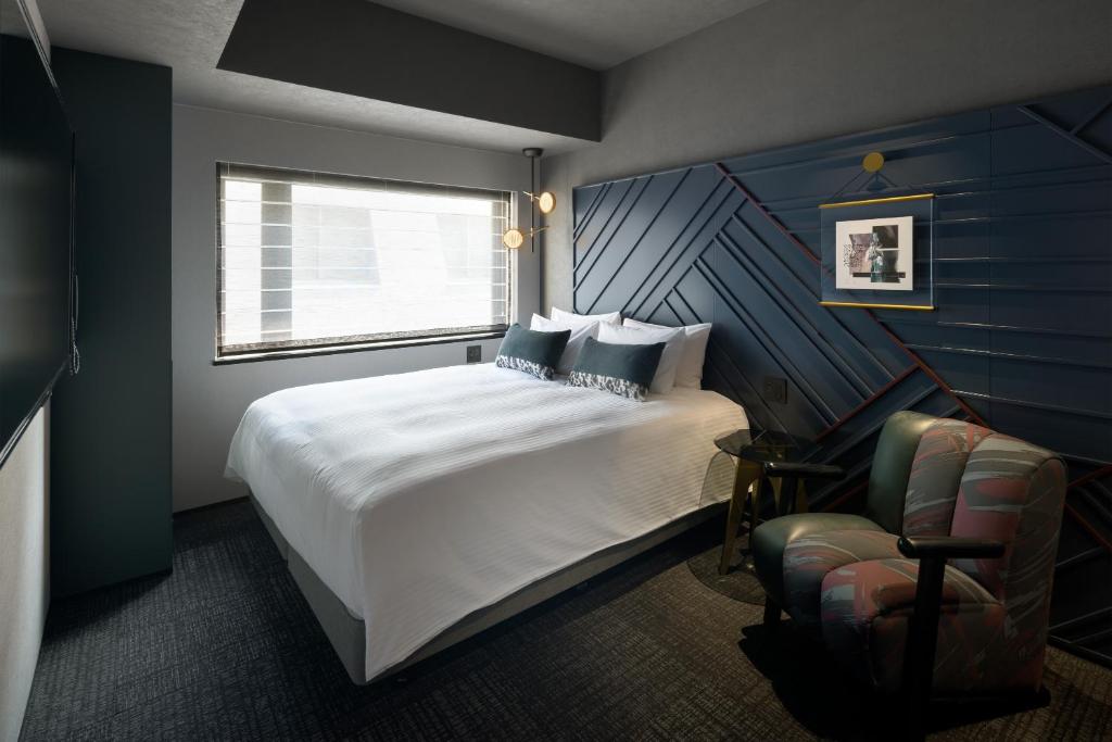 Ein Bett oder Betten in einem Zimmer der Unterkunft Mercure Tokyu Stay Osaka Namba