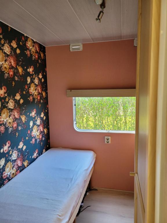 Postel nebo postele na pokoji v ubytování Camping De Blauwe Reiger
