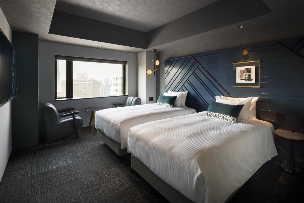 Ein Bett oder Betten in einem Zimmer der Unterkunft Mercure Tokyu Stay Osaka Namba