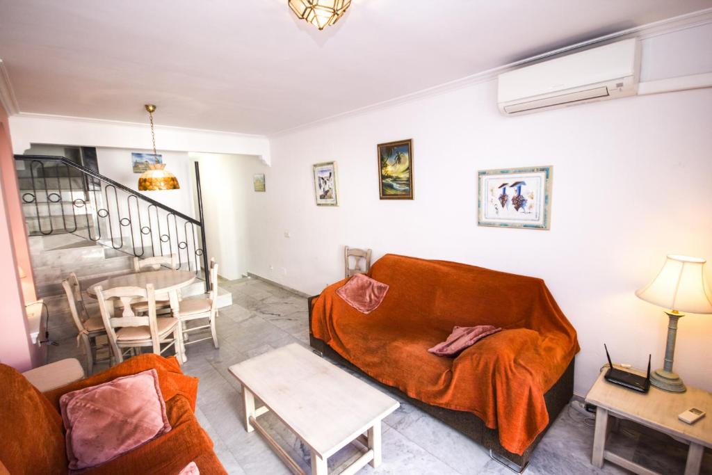 A seating area at Canovas Nerja - Casa adosada con piscina Los Huertos 7