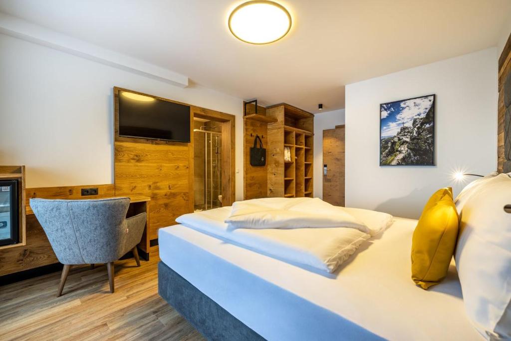 Postel nebo postele na pokoji v ubytování Aparthotel Fuxbau