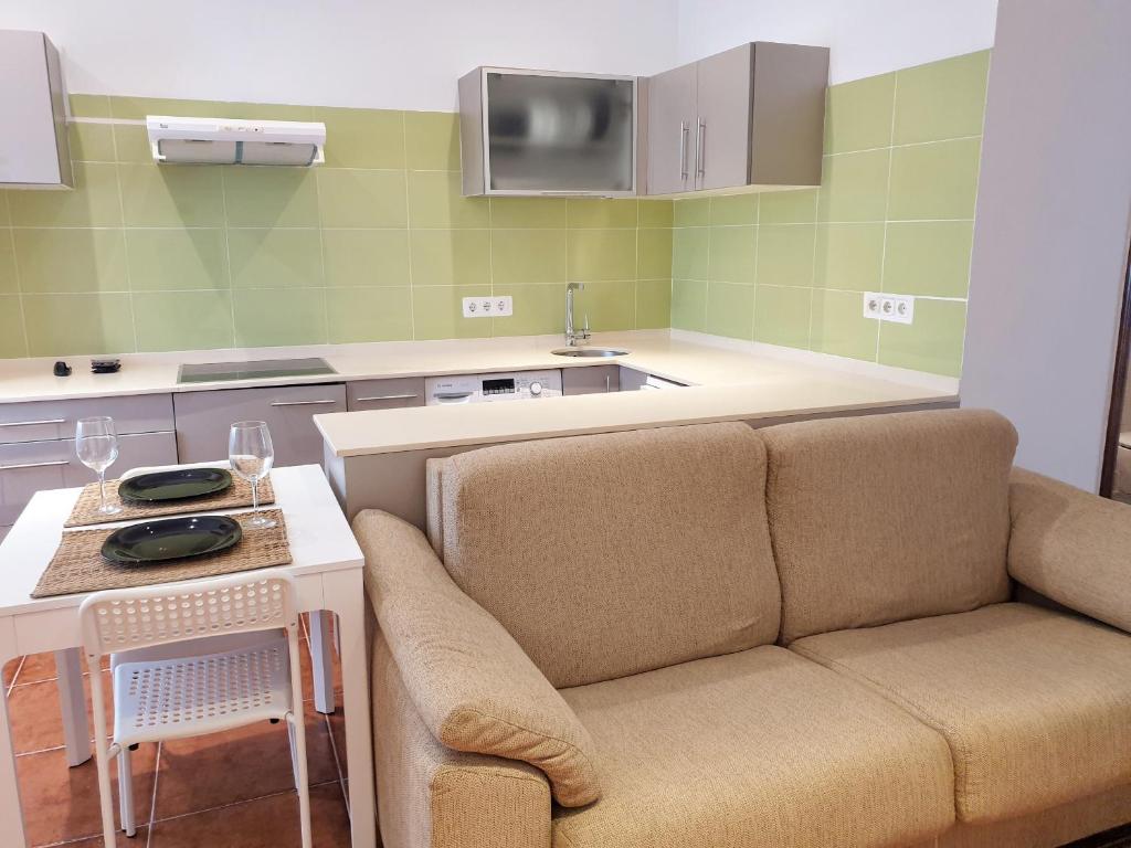 a living room with a couch and a table at Apartamento Garro by SanSe Holidays in San Sebastián